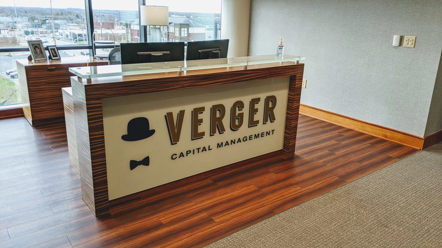 Lettering on existing acrylic for Verger Capital in Downtown Winston Salem, NC