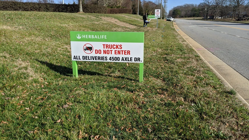 Vinyl Print over out dated metal signage for a fresh new look for Herbalife in Winston-Salem, NC