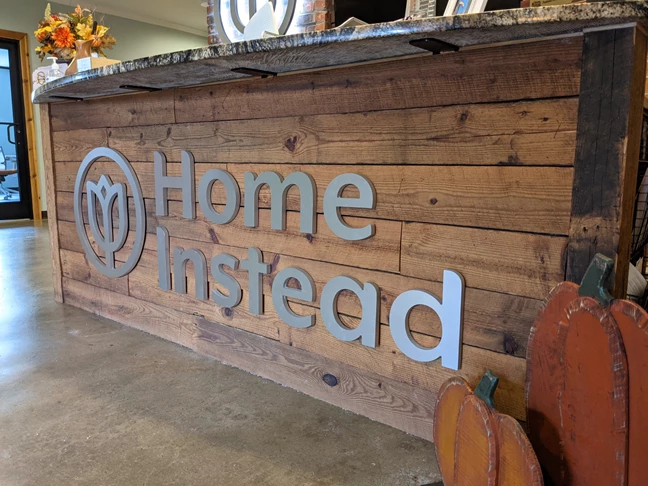Home Instead Dimensional Desk Logo